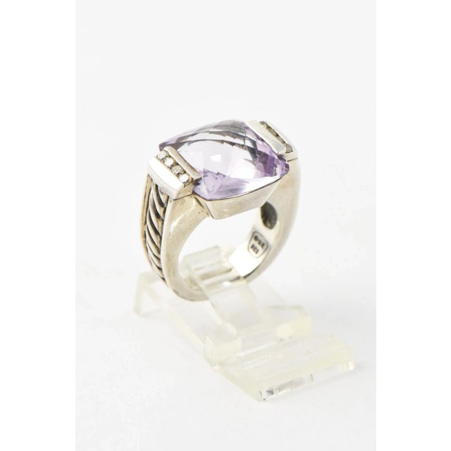 David Yurman sterling silver cocktail ring from the Deco collection. Features a cushion-shaped amethyst center with...