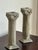 Offering a lovely vintage pair of Neoclassical-style cast plaster candlestick holders in the form of fluted Corinthian...