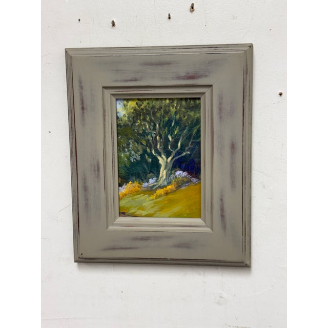 Design Plus Gallery presents a Framed Tree in Grove Painting. This expression of this art piece is impressionistic with...