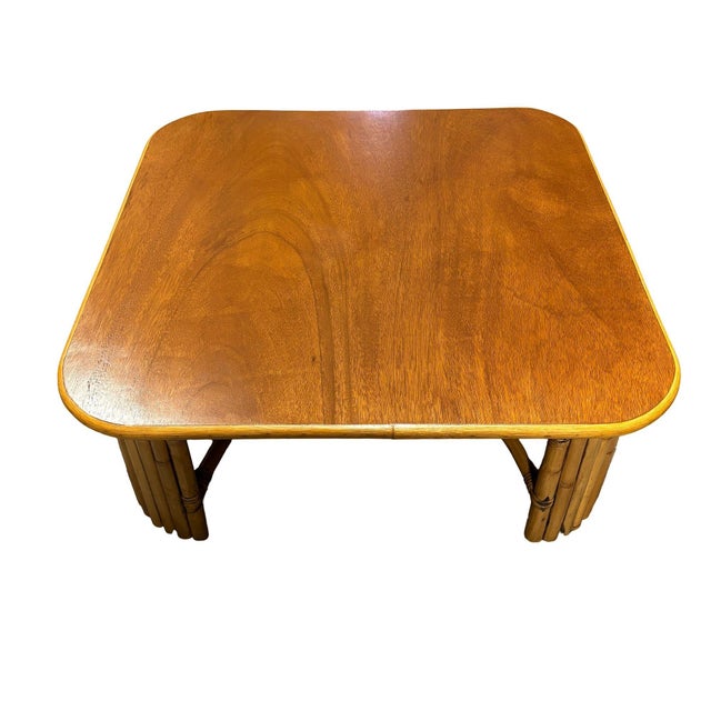 Restored oversized 37" square coffee table with 8-strand vertically stacked rattan legs and a mahogany wood top with a...