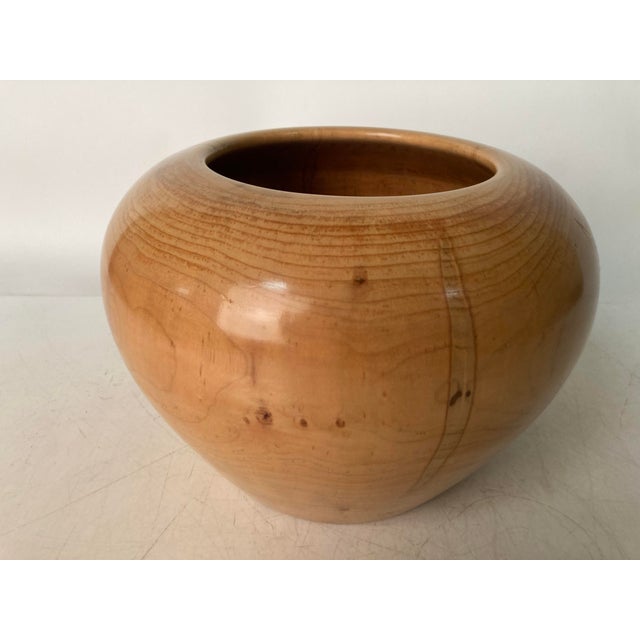A very well crafted Turned Maple Bowl with good weight, a solid feel and fine plumbate form. Numbered 676, signed R....