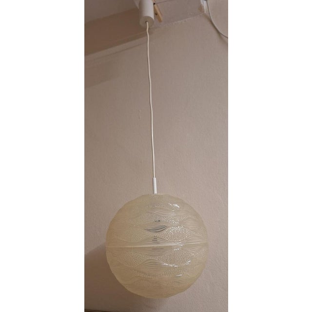 Vintage Ceiling Lamp in the Shape of a Clear Relief Plastic Ball, 1970s, in Good conditions. Designed 1970 to 1979 Up to...