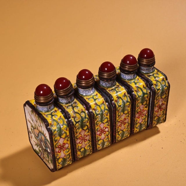This is a set of six matching cloisonné enamel snuff bottles, each featuring a different pair of hand-painted zodiac...
