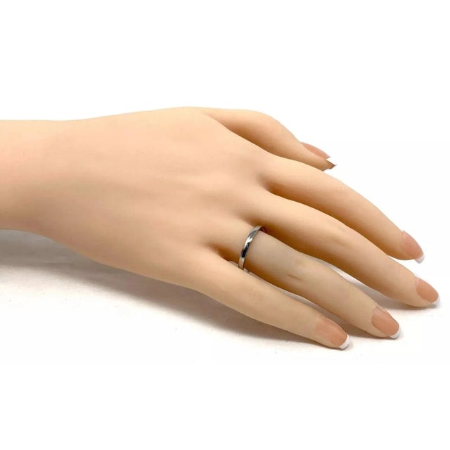 This authentic necklace is by Cartier from the TRINITY collection, the sturdy strand rolo link chain is crafted from solid...