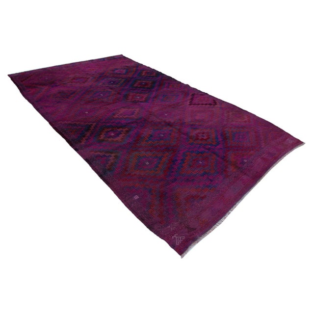 This special kilim rug features an added embroidery motif on top of it's flat weave. Embroidery motifs have several...