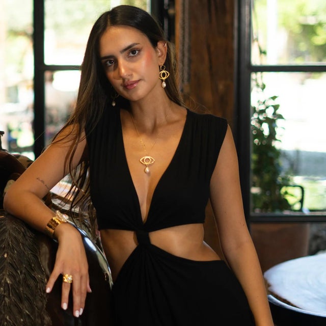 Channel the mystical energy of ancient Egypt with the Cleopatra’s Guardian Eye Pearl Gold Necklace. Featuring a striking...