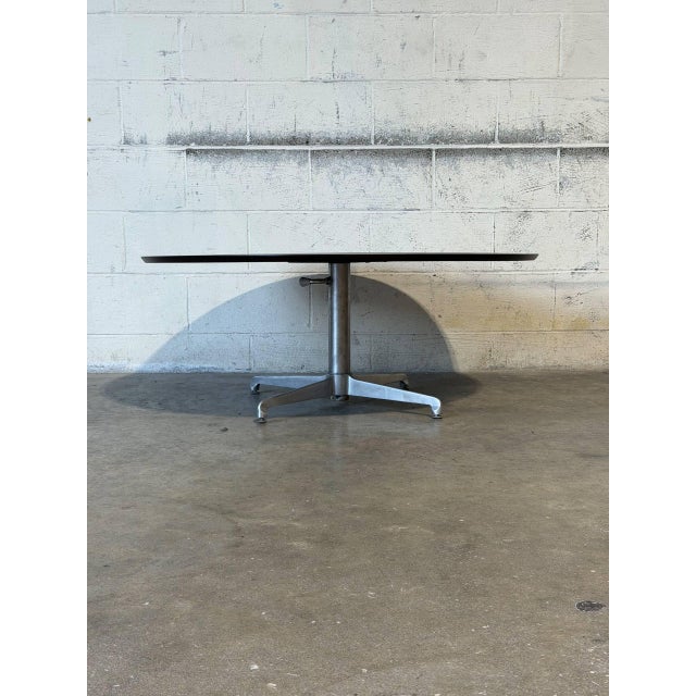 This versatile round table features an innovative adjustable height mechanism. It transforms from a low coffee profile...