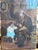Charming antique oil-on-canvas genre painting depicting an older craftsman seated beside a young child in a rustic...