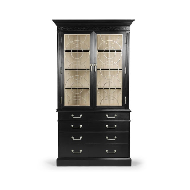 Crafted from premium wood in a formal black finish, it features striking geometric metal accents on glass doors,...