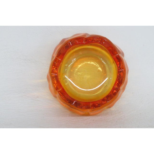 This darling Flower Tealight Holder is made of glass. This lovely tealight holder is shaped like a blossom with open...
