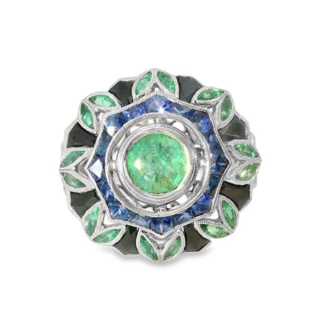 Magnificent handmade estate ring crafted in 18K white gold, featuring natural hand-cut blue sapphires totaling 2.5 carats,...