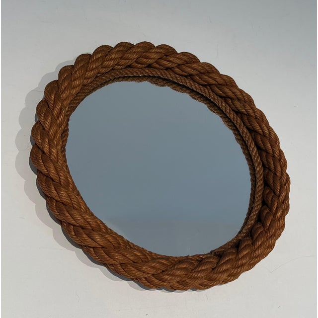 This lovely round mirror is made of rope. It is a French work in the style of Adrien Audoux and Frida Minet (Audoux-...