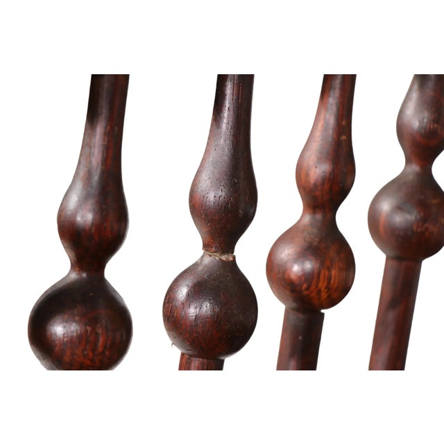 Aesthetic Movement, Victorian platform rocker having a twisted wood frame, with stick and ball style slates and an...