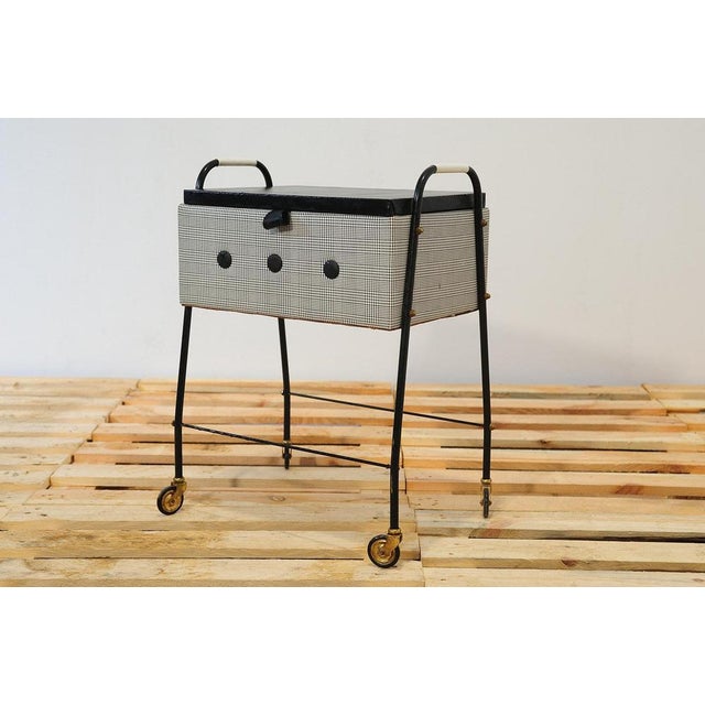 This sewing table on wheels was made in Germany in the 1970s. It can also be used, for example, as a serving table or...