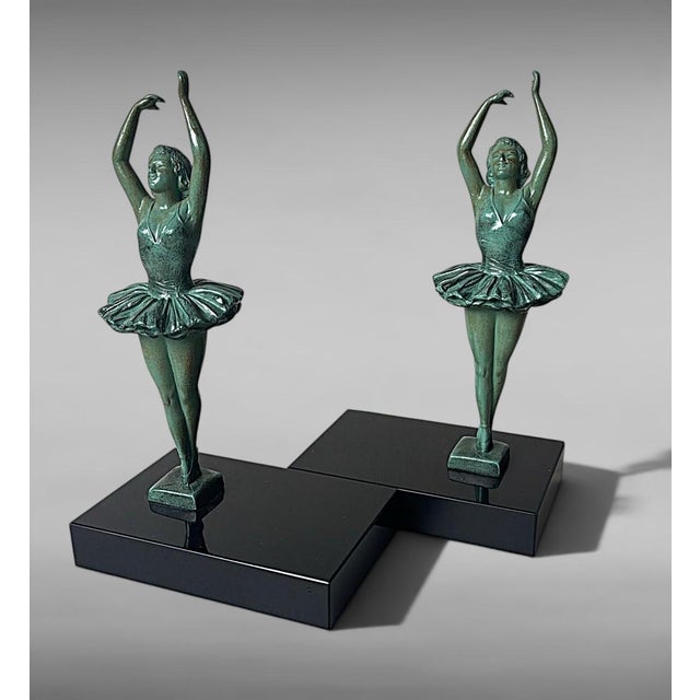 An unusual and highly decorative pair of Art Deco bookends depicting two elegant dancers. The set was crafted between 1930...