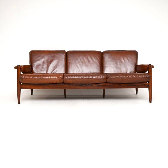 An outstanding vintage Danish leather sofa, recently imported from Denmark and dating from the 1960’s. It is of...