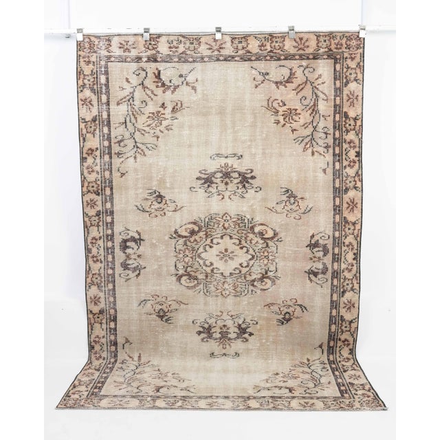 Vintage Turkish Hand-Knotted vintage rug is a semi-antique vintage Area rug.'70s Eastern region of Turkey's unique rug is...