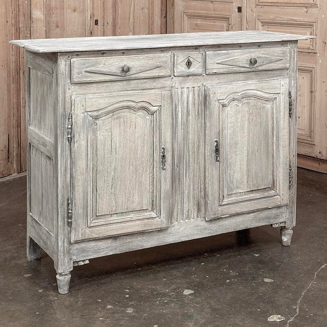 18th Century Directoire Period Country French Whitewashed Buffet is a splendid example of the tailored architecture made...