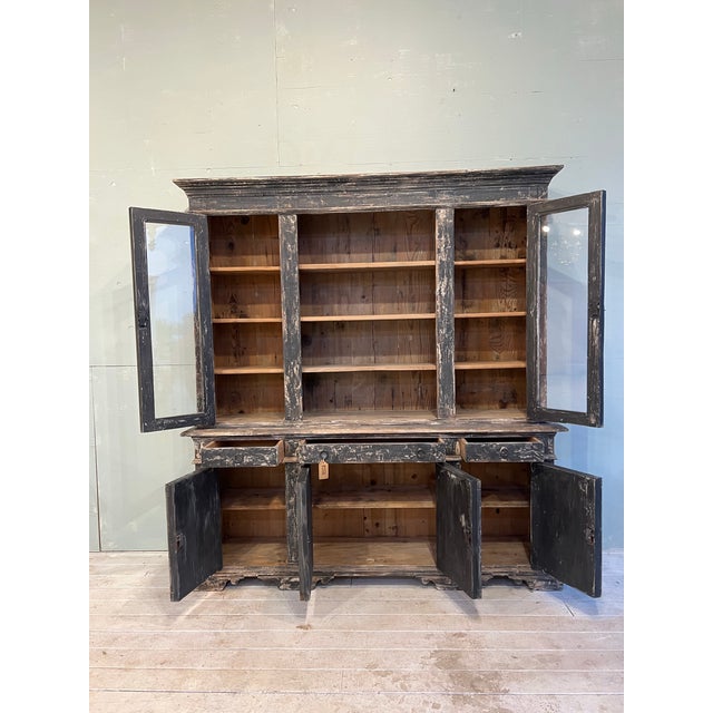 Handsome 19th century Italian, two part cabinet with glass storage above and covered storage below! This lovely peace was...