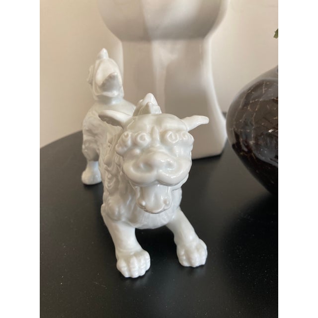 A rare Blanc de chin porcelain foo dog statue in excellent condition. Would have originally been part of a pair. There is...