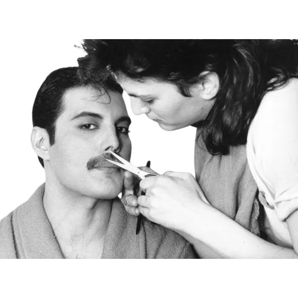 By photographer Steve Wood, 1982: Rock singer Freddie Mercury of the popular British group Queen has his mustache groomed....
