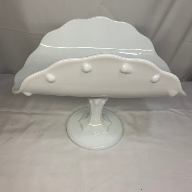 Offered here is a vintage Indiana Glass white milk glass teardrop banana stand or banana boat pedestal dish from the 1950s.