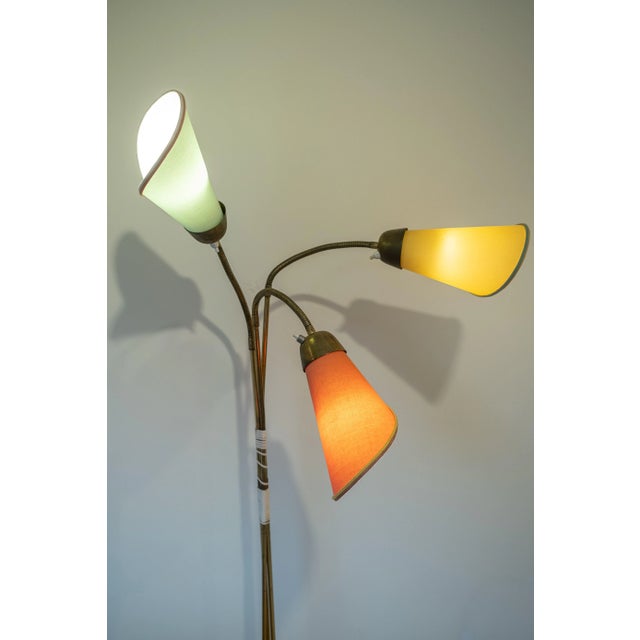 An iconic piece of post-war Italian design, this authentic three-light floor lamp was produced by Stilnovo, the renowned...