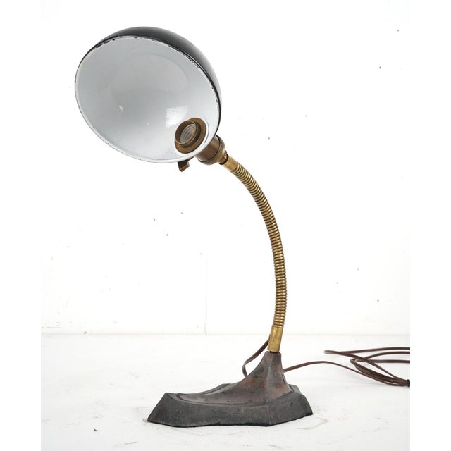 1920s Industrial style desk lamp made of steel with a black, copper, and antique brass finish. Great condition with some...