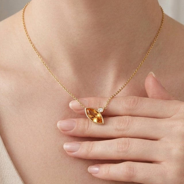 Elevate your jewelry collection with this elegant Marquise Citrine Necklace, expertly crafted in 18K gold plated over 925...
