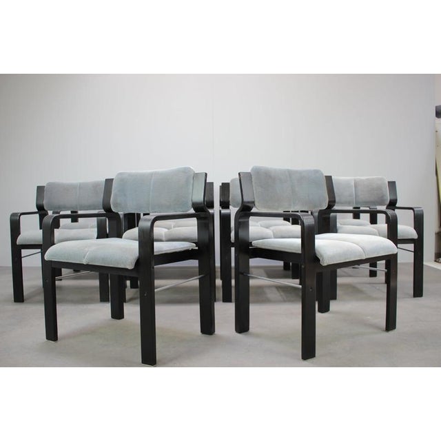 A distinctive set of ten vintage armchairs designed by Ludvik Volak and manufactured by Dřevopodnik Holešov in...