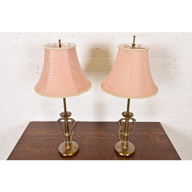A gorgeous pair of Art Deco style brass table lamps In the manner of Ralph Lauren Circa Late 20th Century Measures:...