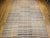 A striking 19th century American Amish rag rug, room-size and composed of three expertly joined woven runners to form one...