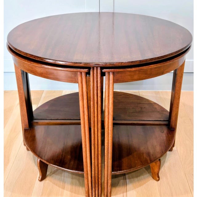 Beautiful mid-century nesting cocktail table set by Fyne Ladye Furniture of Banbury, England, featuring a round mahogany...