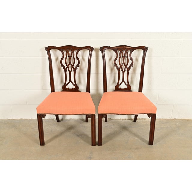 An outstanding pair of Georgian or Chippendale style side chairs or dining chairs By Baker Furniture USA, Circa 1980s...