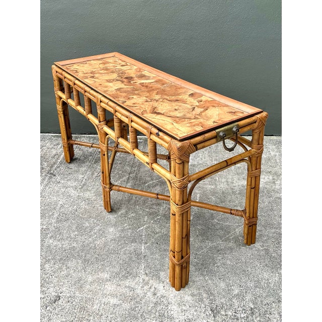Discover the perfect marriage of organic texture and sophisticated glamour with this exceptional vintage console table. A...