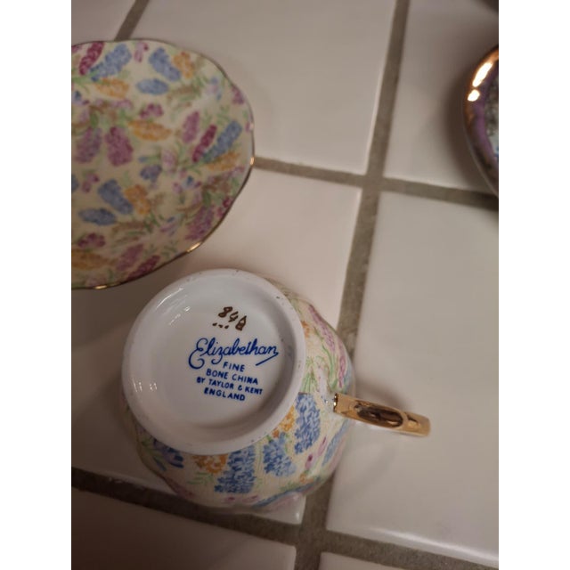 ​Brighten your afternoon tea with this exquisite vintage teacup and saucer set from Elizabethan Fine Bone China, produced...