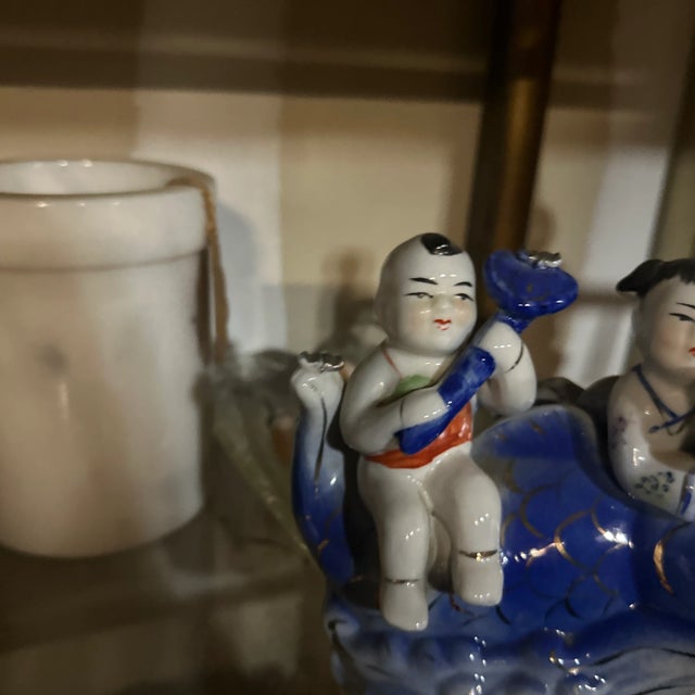 Up for consideration is a beautiful vintage blue and white asian style children ceramic sculpture. This is lovely...