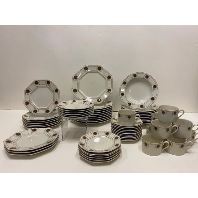 Handsome dinnerware by Fitz & Floyd for 10 lucky diners, having Le Continentale pattern in cream and brown, including...