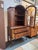 Design Plus Gallery presents an Antique Mahogany China Cabinet in the Queen Anne Style. The cabinet has a tall base that...