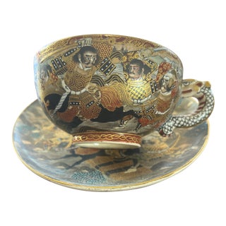 Late 19th Century Meiji Satsuma Cup and Saucer With Warriors in Armor and a Dragon Handle For Sale