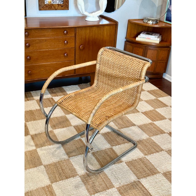 A chrome and wicker MR20 armchair attributed to Ludwig Mies Van der Rohe for Stendig, circa 1960-70s. Made in Italy. There...
