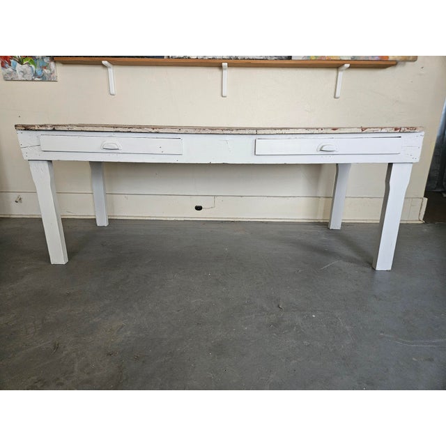 A generously large, antique farmhouse table. This table is heavy, well built and solidly made of pine. It’s wide plank top...