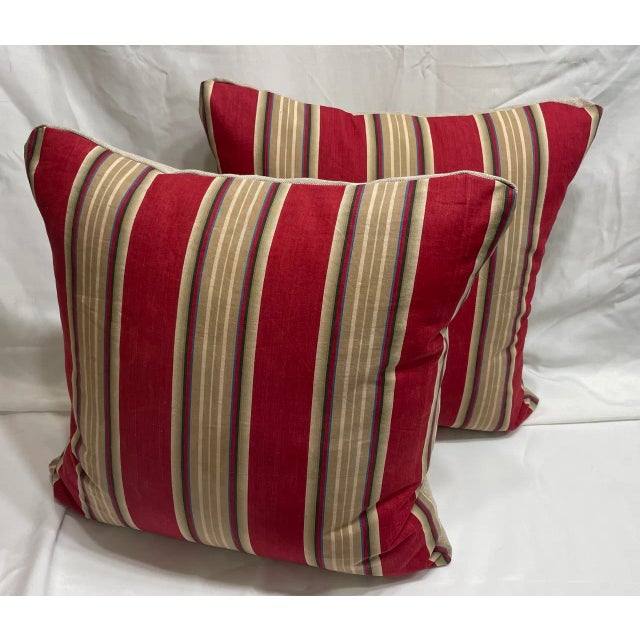 Pair of Pillow covers made of a Vintage French ticking fabric fragment, red, tan, blue and beige circa early 1900, with...