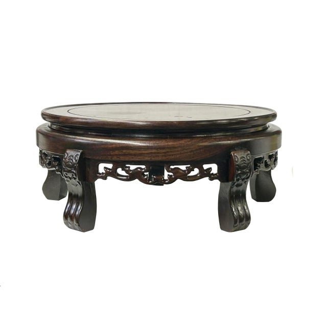 This is a handmade Chinese accent decorative display stand made of wood with an oriental relief motif accenting around the...