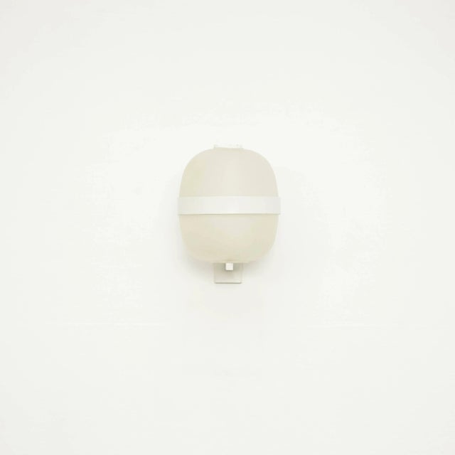 This pair of model Wally sconces was produced around 1962. The pieces feature metal structures and plastic shades. Up to...