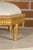 A French Neoclassical carved giltwood footstool from the 19th century with custom linen upholstery. This exquisite 19th-...