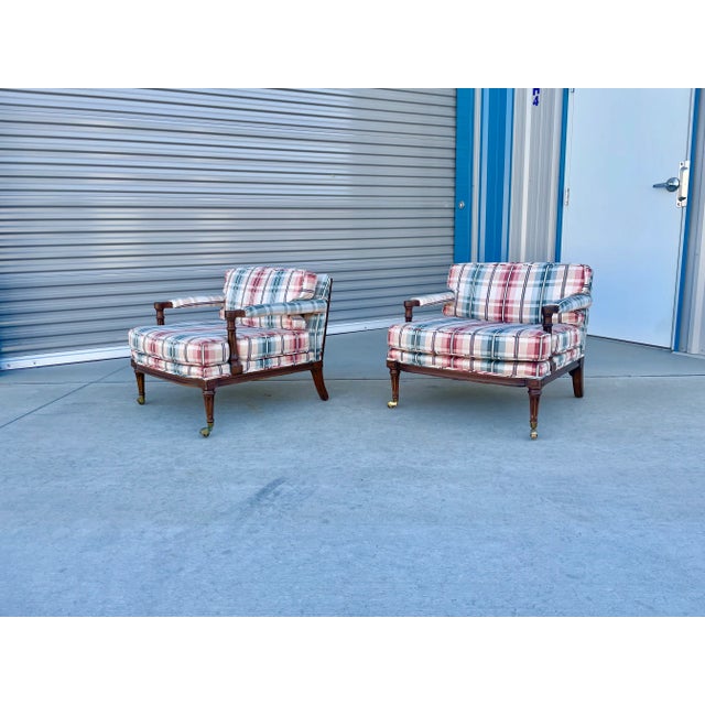 This charming pair of vintage armchairs blends timeless English traditional style with classic tailored comfort. Featuring...