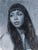 The painting captures a contemplative figure, her gaze directed away from the viewer, evoking a sense of introspection and...