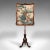 This is an antique fireside pole screen. An English, walnut and glass embroidered panel on adjustable riser, dating to the...