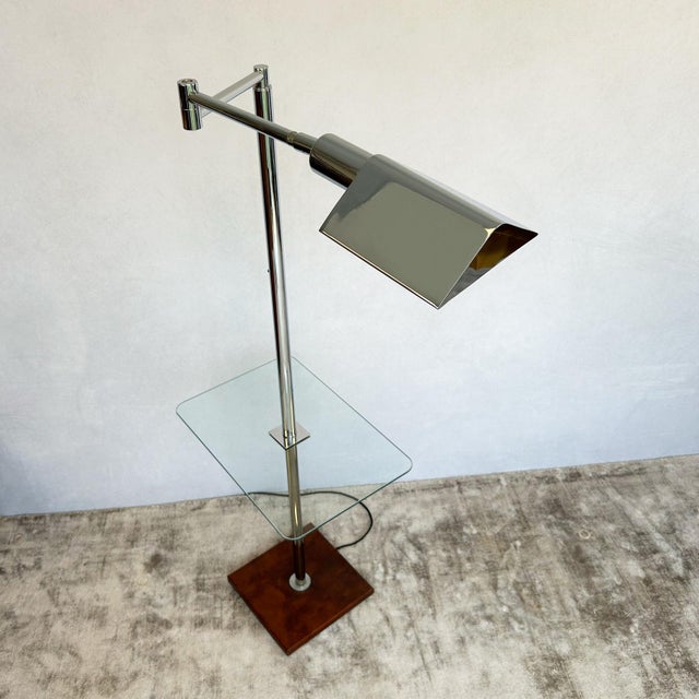 Chrome floor lamp by Koch & Lowy featuring adjustable rectangular shade mounted on polished chrome column with integrated...